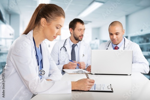 Doctors teamwork collaboration with documents in hospital