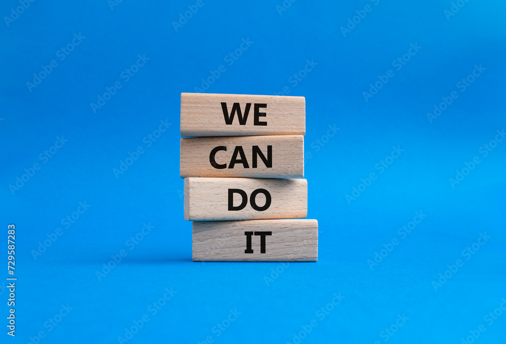 We can do it symbol. Concept words We can do it on wooden blocks. Beautiful blue background. Business and We can do it concept. Copy space. We can do it symbol. Concept words We can do it on wooden blocks. Beautiful blue background. Business and We can do it concept. Copy space.