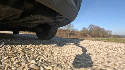 Driving on a quiet country road with fields