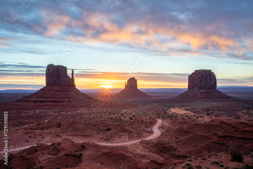 Monument Valley with its epic rock formations at sunrise between Arizona and Utah in Southwest of USA photo