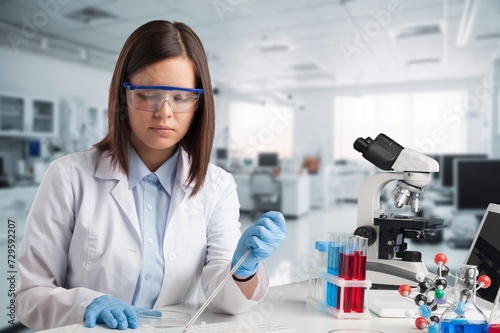 A young researcher with ingredients of vegetables. Registered dietitian.