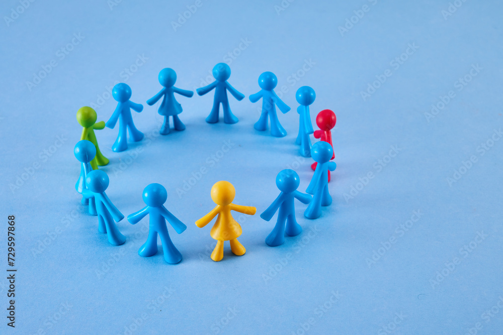 Diversity and inclusion concept. Colorful figurines on blue background Diversity and inclusion concept. Colorful figurines on blue background