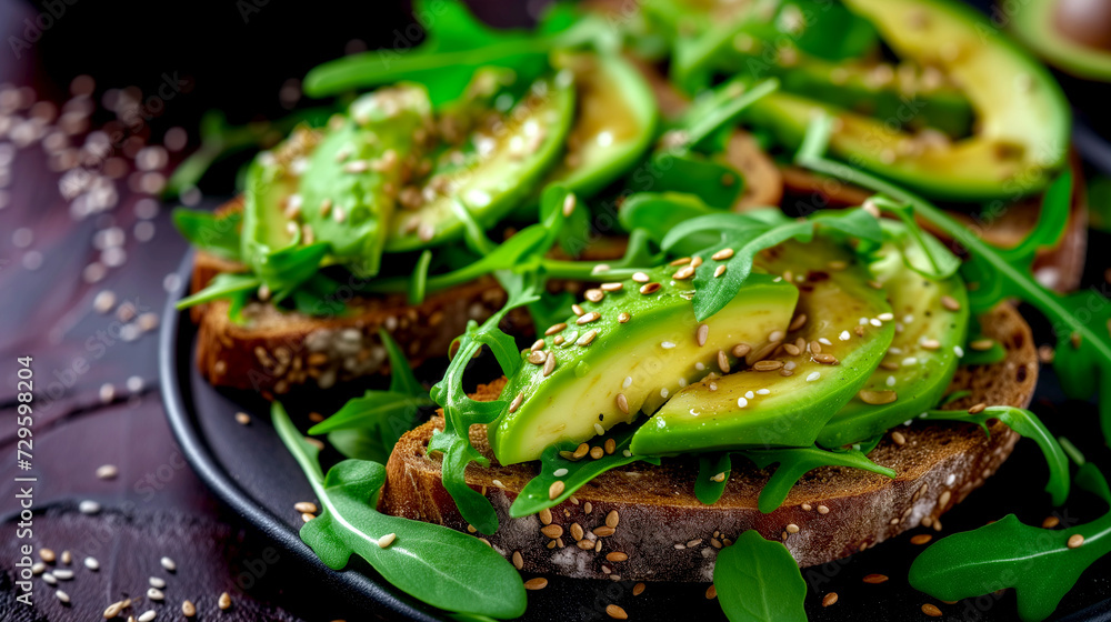 Toast with avocado and rye bread. Sandwich with chopped avocado, beets, sesame seeds. Close-up. Toast with avocado and rye bread. Sandwich with chopped avocado, beets, sesame seeds. Close-up.