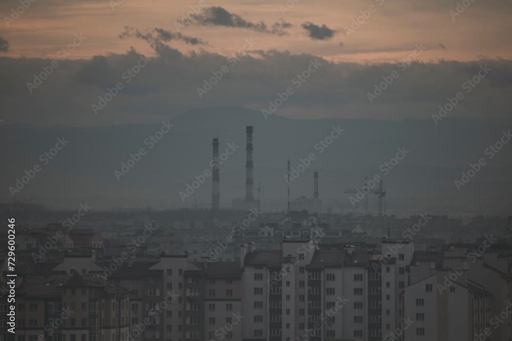 the city in the fog. photo of the city from a high mountain