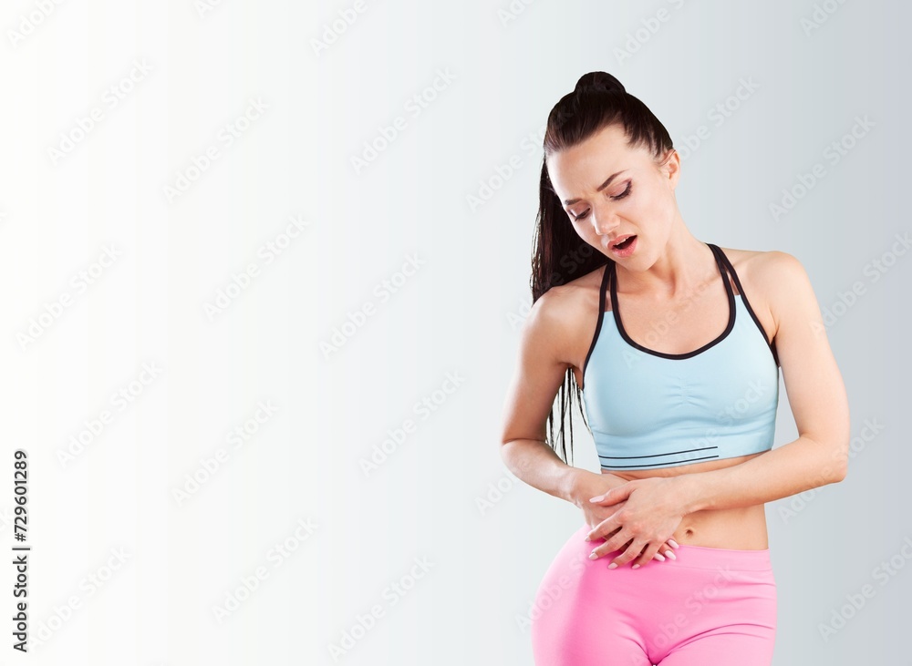 Young caucasian woman with hand on stomach painful feeling unwell. Young caucasian woman with hand on stomach painful feeling unwell.