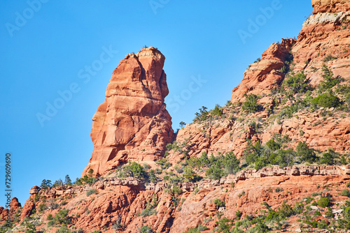 Sedona Red Rock Spire with Greenery under Blue Sky