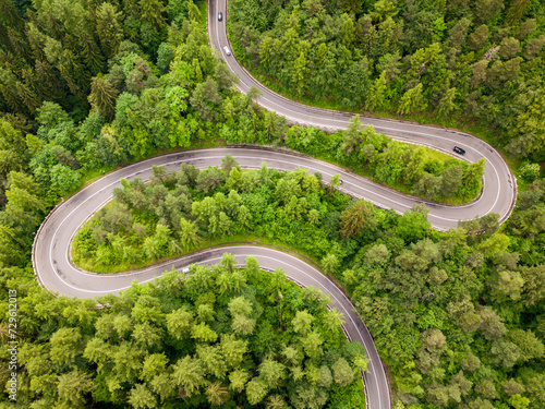 Aerial view of a road in the middle of the forest