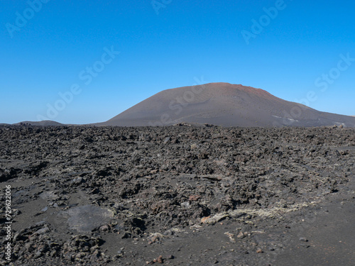 The volcanic mountain landscape of Lanzarote, Spain, under a clear sky