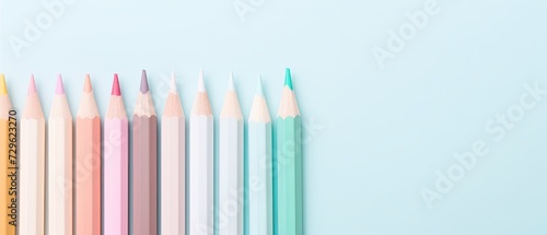 Chromatic Symphony: A Mesmerizing Parade of Pastel Colored Pencils on a Vivid Blue Canvas