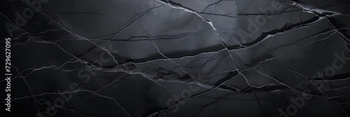 Black grunge banner. Abstract stone wall texture background. Close-up shot with gray veins. Dark rock backdrop with copy space for designs