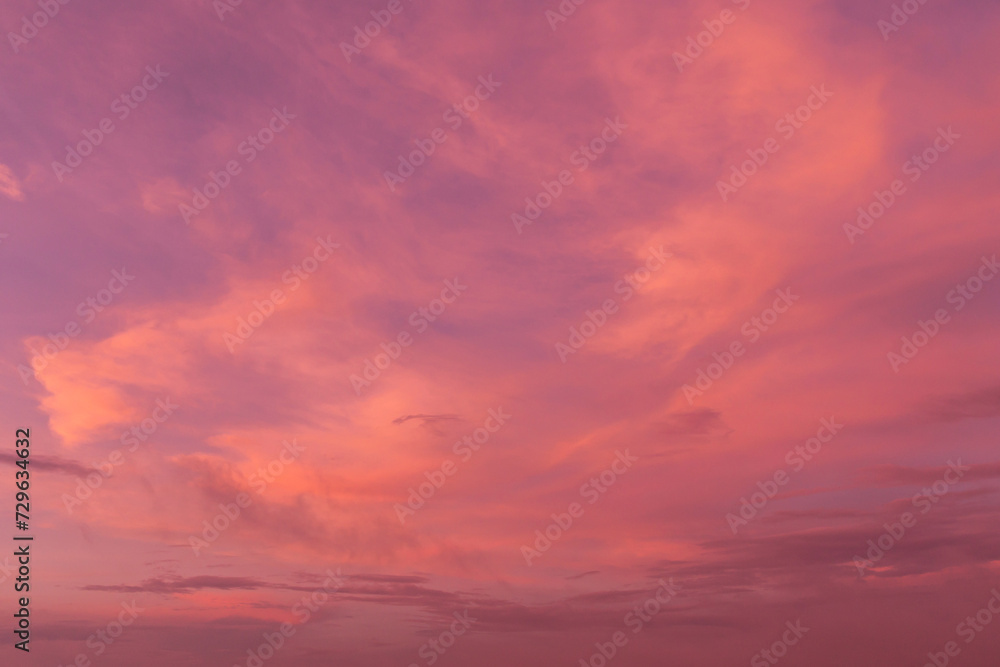 Epic Dramatic soft sunrise, sunset orange sky with cirrus clouds in sunlight abstract background texture