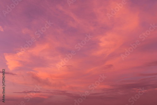 Epic Dramatic soft sunrise  sunset orange sky with cirrus clouds in sunlight abstract background texture