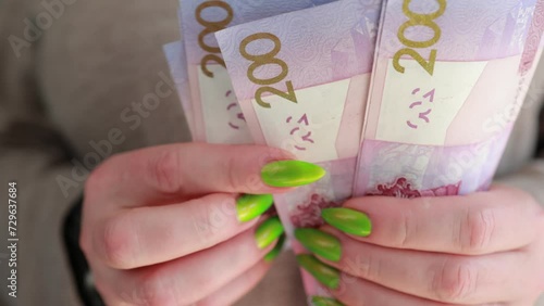 Female hands holding paper bills Belarusian rubles  photo