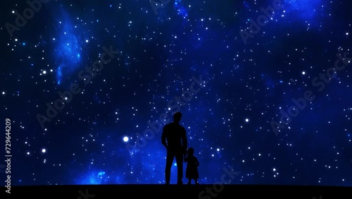 Silhouette of father and daughter against a starry sky and stars flying by. Parent and child on the background of blue fantastic constellations. High quality 4k footage photo