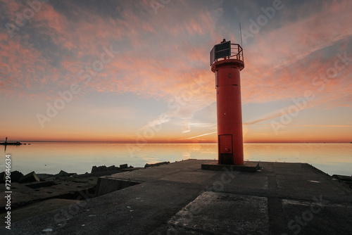 sunset lighthouse on the coast