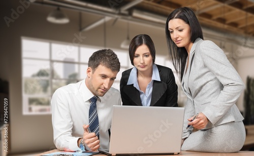 Busy business workers discussing project in office