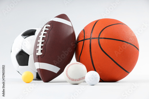 Many different sports balls on light gray background © New Africa