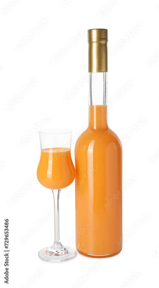 Bottle and glass with tasty tangerine liqueur isolated on white Bottle and glass with tasty tangerine liqueur isolated on white