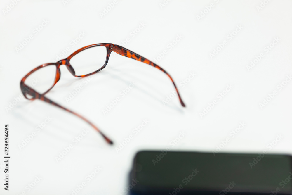 Glasses with case on white background. Copy space, selective focus.