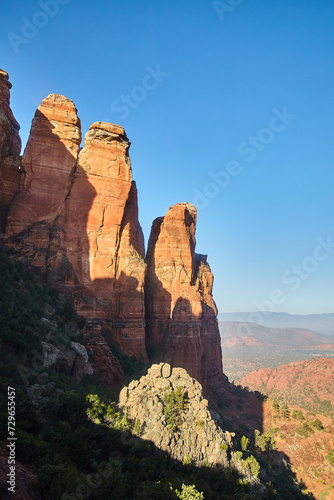 Sedona Red Rock Formations with Lush Foliage Under Blue Sky