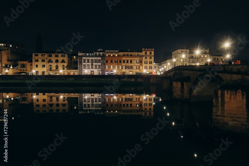 Embankment of Arno River at night, in Florence, Italy