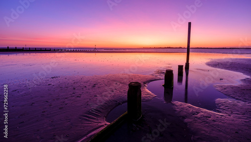 Sunset over West Wittering Beach, West Sussex, UK photo