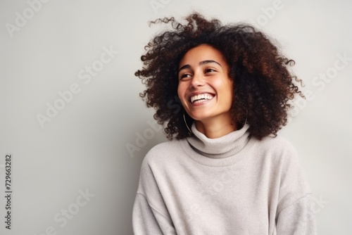 Beautiful african american woman with afro hairstyle smiling