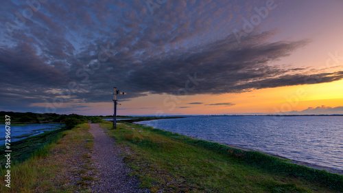 Sunset on the Hayling Billy Trail old railway near Langstone, Hampshire photo