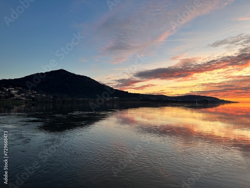 Sunset over the river Minho and the mountain near Eiras, O Rosal, Galicia, Spain, January 2023 photo