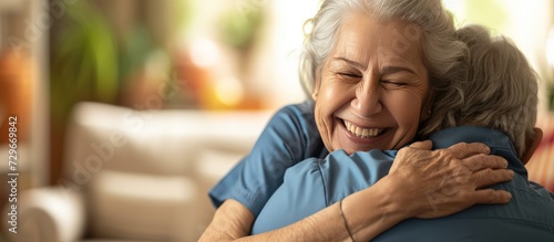 Portrait happy woman nurse hug her old senior patient in elderly care house. AI generated image photo