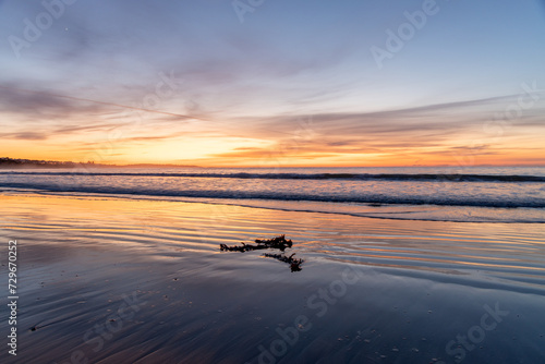 A Victor Harbor sunrise over the beach reflecting in the sand in South Australia on September 11th 2023