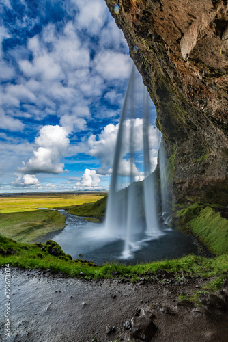 Long exposure  waterfall in the mountains  travel destination Iceland  summer