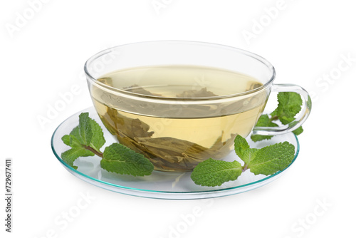 Refreshing green tea in cup and mint leaves isolated on white
