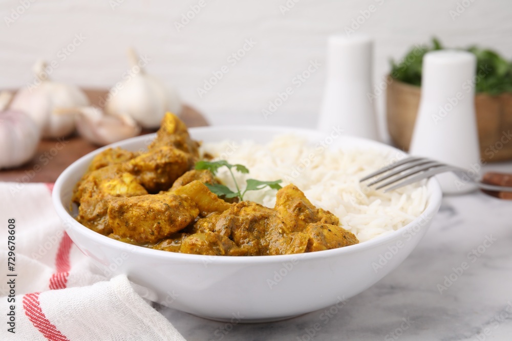 Delicious chicken curry with rice on white marble table, closeup Delicious chicken curry with rice on white marble table, closeup