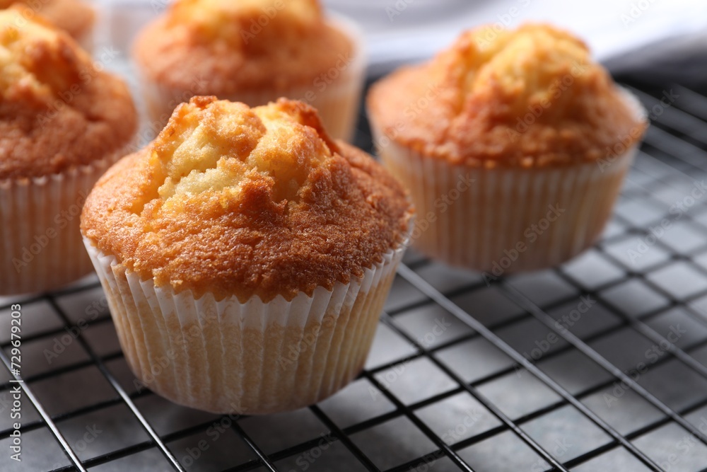 Delicious sweet muffins on grey table, closeup. Space for text Delicious sweet muffins on grey table, closeup. Space for text