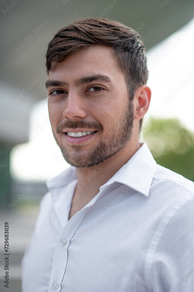 Bearded young man looking contented and smiling Bearded young man looking contented and smiling