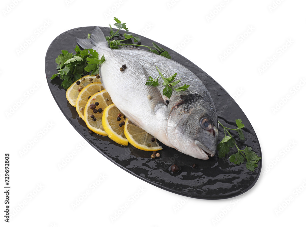 Raw dorado fish, parsley, lemon slices and peppercorns isolated on white Raw dorado fish, parsley, lemon slices and peppercorns isolated on white