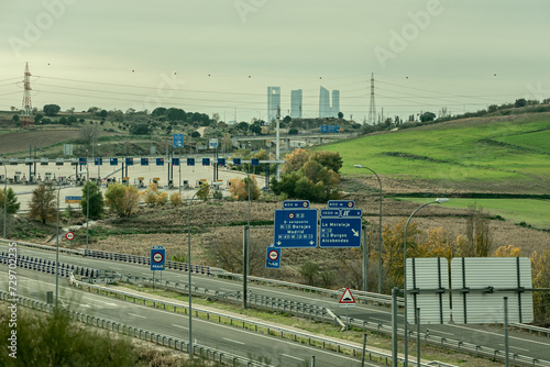 Access highway to the northern area of Madrid, toll booths and with the area of the four towers in the background