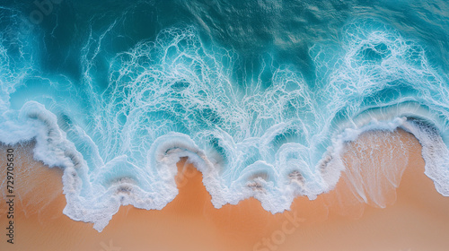 Drone top view at a tropical beach with a bleu ocean, Overhead photo of crashing waves on the shoreline beach. Tropical beach surf. Abstract aerial ocean view