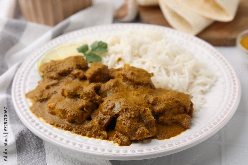 Delicious chicken curry with rice on table, closeup Delicious chicken curry with rice on table, closeup