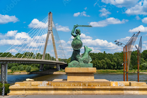 Statue of Syrenka, the Warsaw Mermaid, at Vistula River bank in Warsaw, Poland