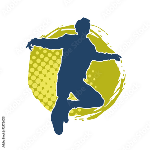 Silhouette of a male dancer in performing pose. Silhouette of a dancing man.