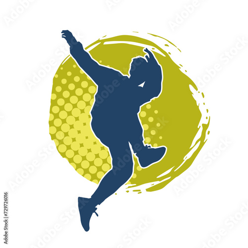 Silhouette of a male dancer in performing pose. Silhouette of a dancing man.