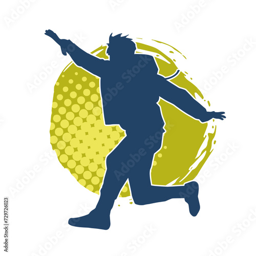 Silhouette of a male dancer in performing pose. Silhouette of a dancing man.