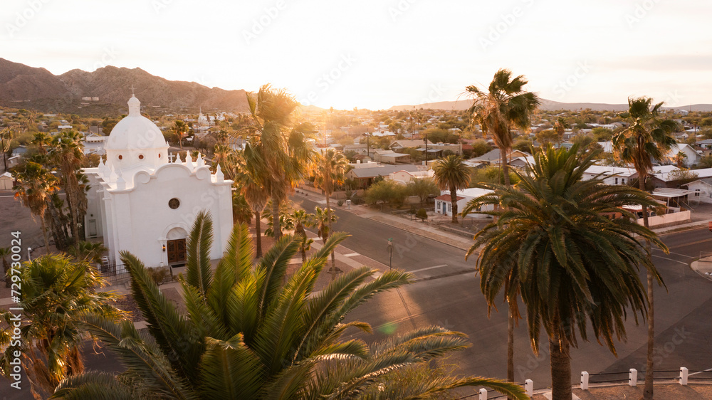 Aerial palm framed view of the historic downtown area of Ajo, Arizona, USA.