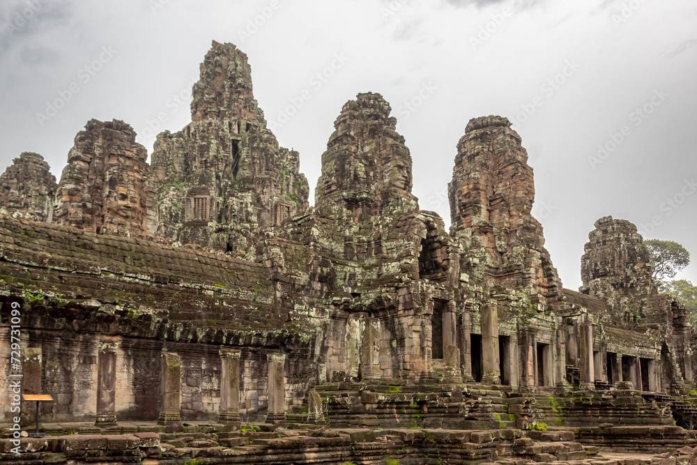 Stone beautiful temple ruin building architecture in Bayon complex Angkor Wat in Seim Reap Cambodia on a cloudy overcast day