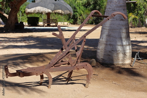 Vestige of an old rusty iron plow