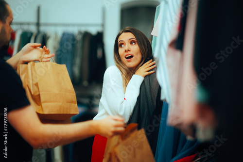 Shopaholic Wife on a Shopping Spree Choosing Clothes. Fashionista with a obsessive compulsive buying problem
