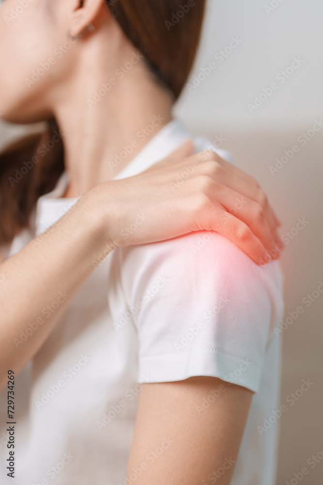 Woman having Shoulder and Neck pain during sitting on couch at home. Muscle painful due to Myofascial pain syndrome and Fibromyalgia, rheumatism, Scapular pain, Cervical Spine. ergonomic concept Woman having Shoulder and Neck pain during sitting on couch at home. Muscle painful due to Myofascial pain syndrome and Fibromyalgia, rheumatism, Scapular pain, Cervical Spine. ergonomic concept