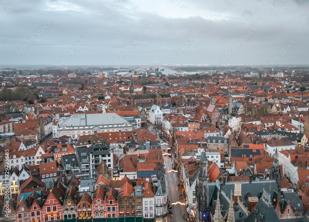 Obraz premium Beautiful aerial city skyline of the village building architecture in Bruges Flanders Belgium on a cloudy day